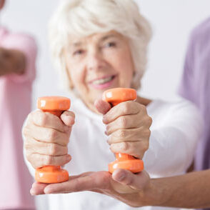 elderly woman exercising with weights